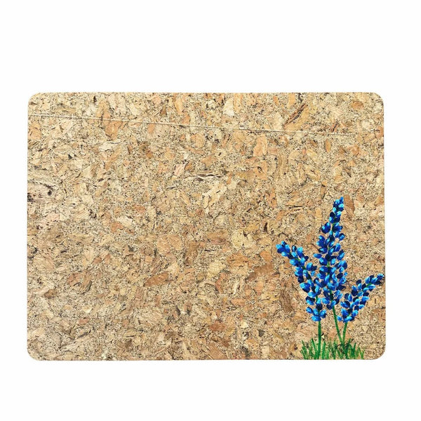 Cork placemat with handpainted bluebonnets on a white background
