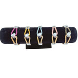 Purple, yellow, light blue, pink and olive bracelets on a black bracelet display.