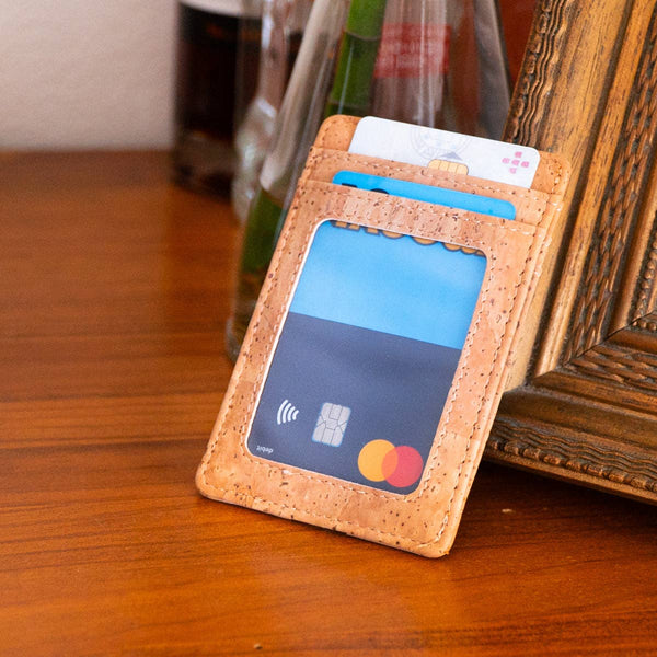 Minimalist cork card wallet with cards on a wooden table