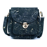 Front of Monaco black cork crossbody bag with gold veining and structured flap