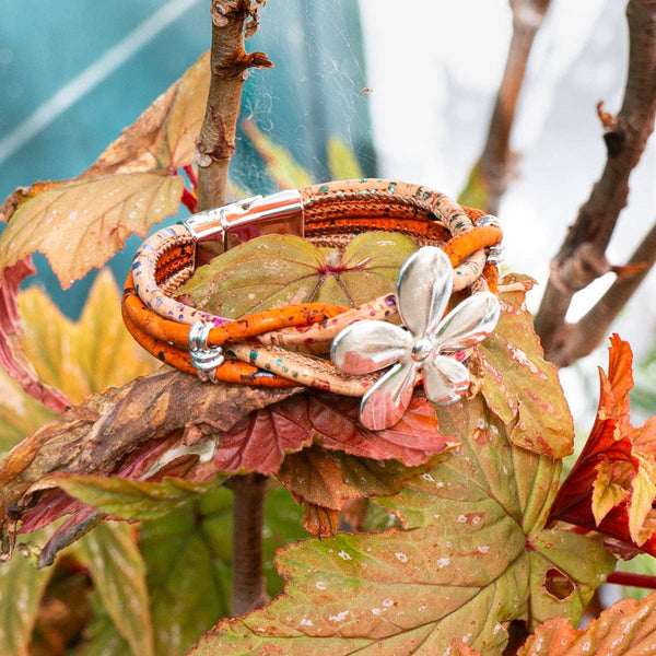 Orange Natural Cork Handmade Women's Bracelet with Flower Pendant on leaves. From Texas Cork Company