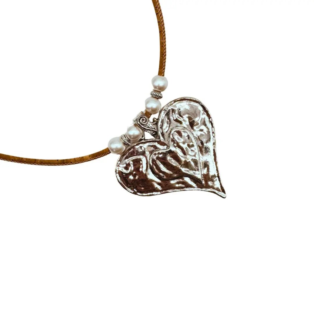 Heart-shaped silver pendant on a natural cork cord with pearl-like beads