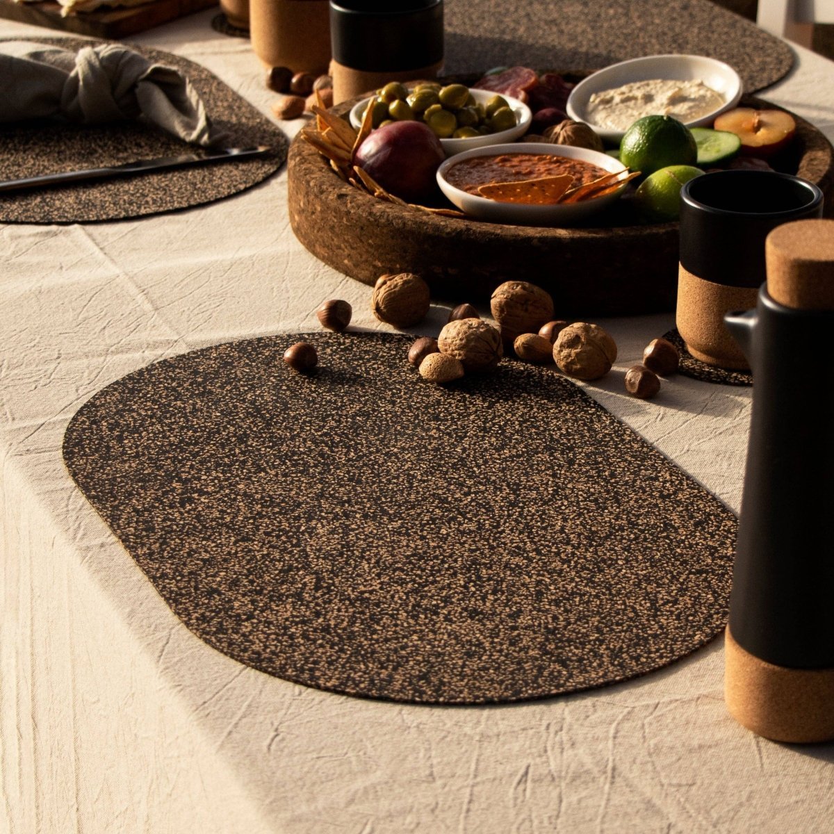 Oval Dash Cork Placemats with cork charcuterie serving dish. From Texas Cork Company