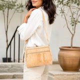 Palm Springs gold fleck cork crossbody bag worn over the shoulder