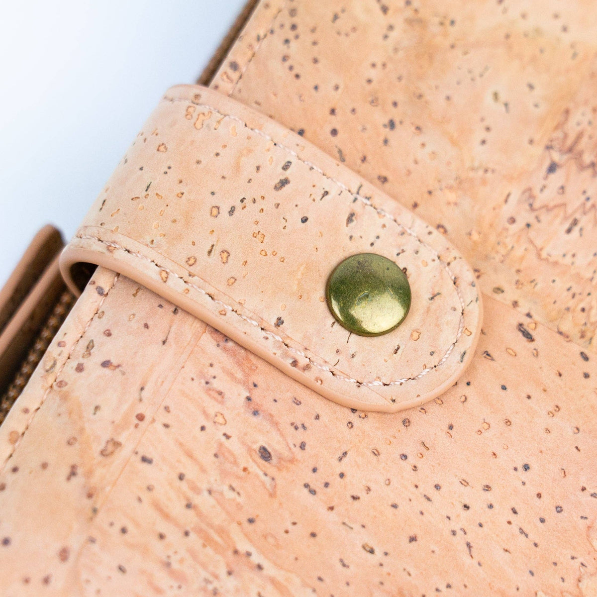 Snap closeup on natural chic cork wallet snap closure from Texas Cork Company