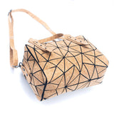Taos Cork handbag bottom and side with geometric pattern on a white background