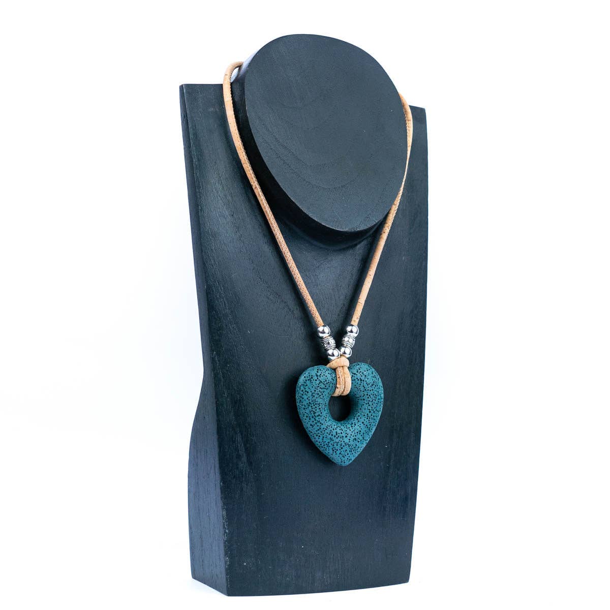 Teal Heart Volcanic Stone Pendant Cork Necklace on a display from Texas Cork Company