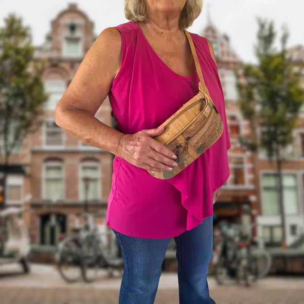 Woman wearing Topeka Cork Sling Belt Bag