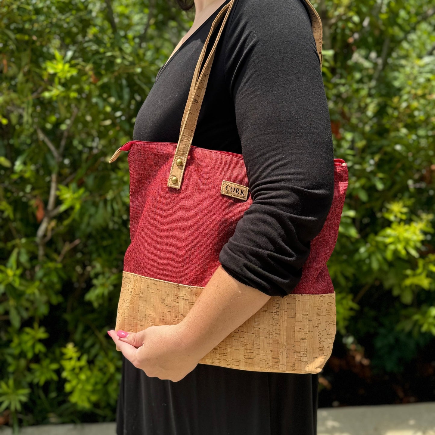 Woman carrying Cork and Fabric Purse Tote - red fabric with vegan rustic cork bottom