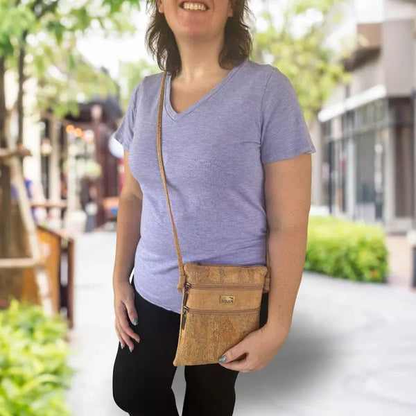 Woman wearing the Charleston Cork Triple Zip Crossbody Bag