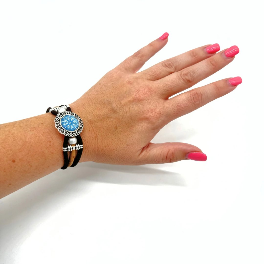Woman wearing Vintagre Azulejo Cork Bracelet with Round Tile Pendant from Texas Cork Company.