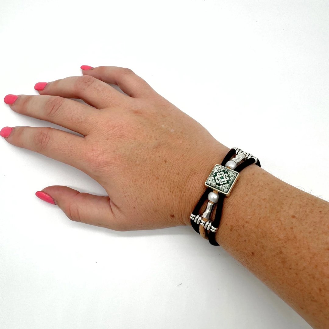 Woman wearing Vintagre Azulejo Cork Bracelet with Square Tile Pendant from Texas Cork Company.